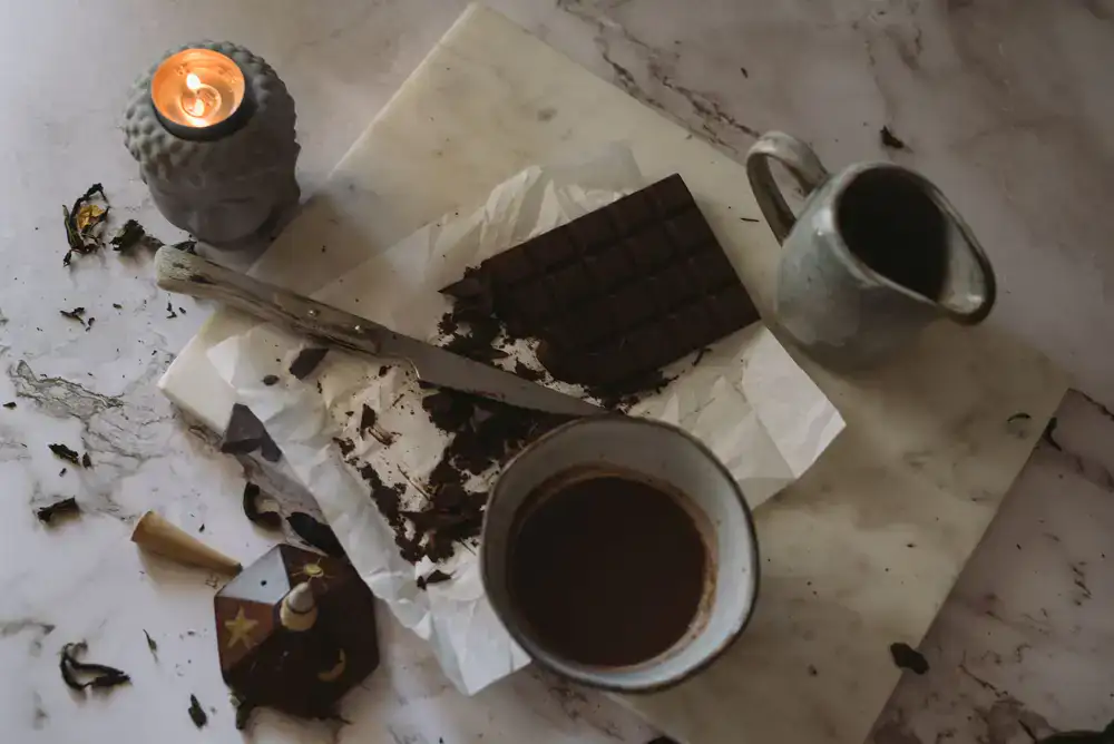 Artisan tempering chocolate on a marble slab
