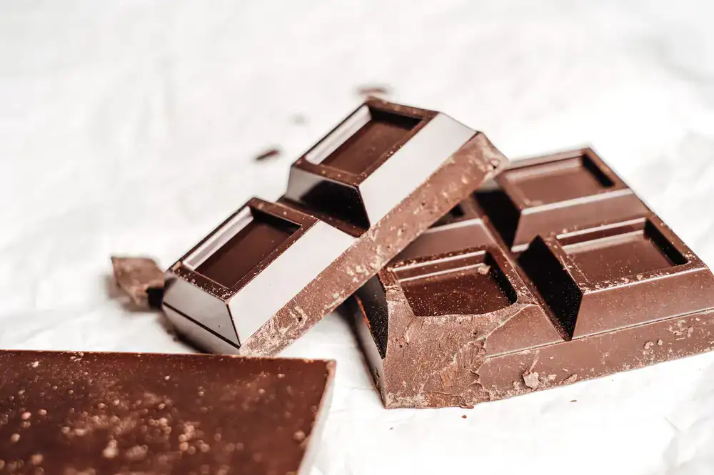 Artisanal dark chocolate bar broken in half